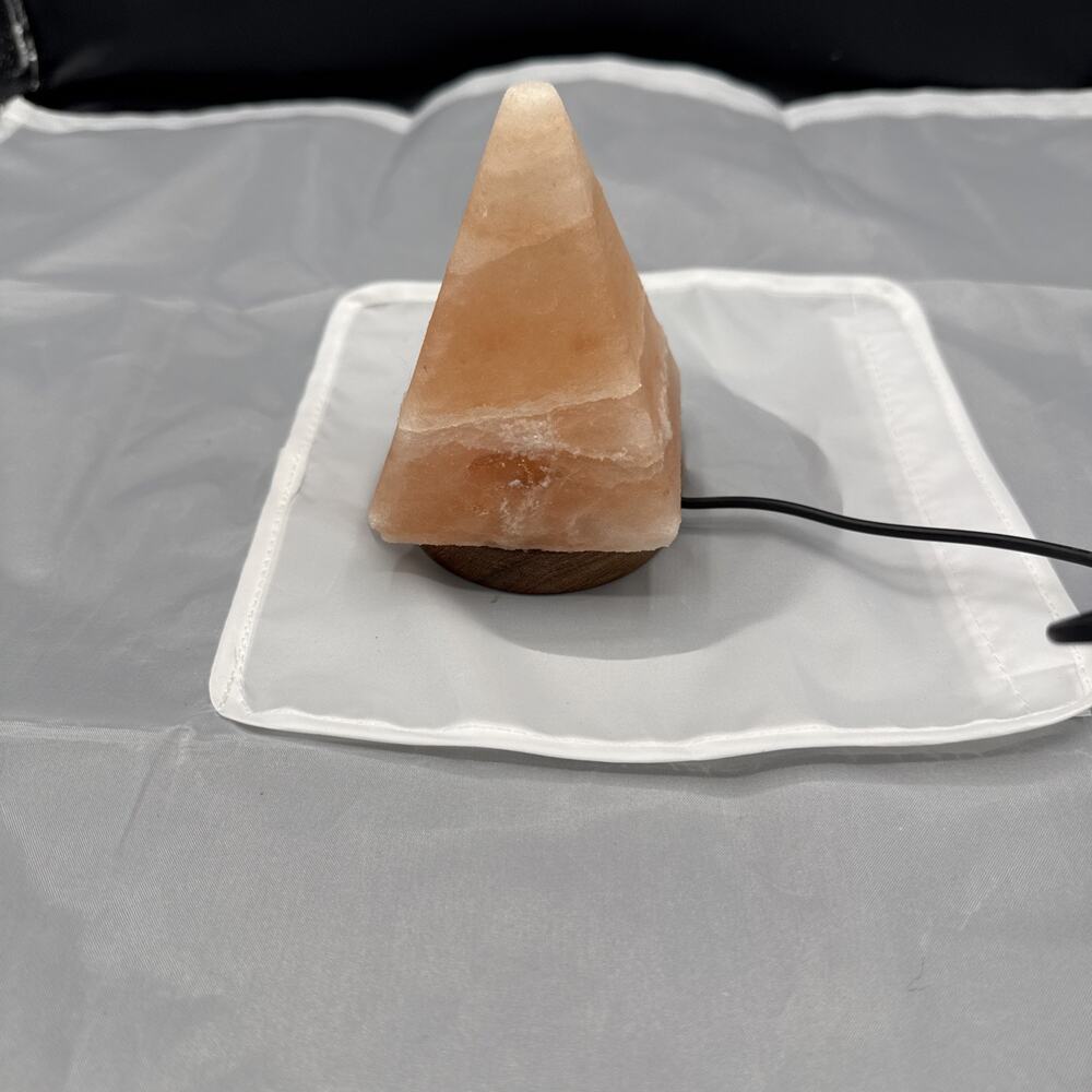 Himalayan salt lamp shaped like a pyramid